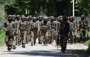 Indian army soldiers shout pro India slogans as they return from the scene of a gun fight at Dialgam in Anantnag some 60 kilometers south of Srinagar, the summer capital of Indian Kashmir, 01 July 2017. A top commander of the militant outfit Laskhar-e-Toiba (LeT) Bashir Lashkari and his associate were killed during the gunfight with security forces in Anantnag. Two civilians were also killed and several others injured as government forces allegedly opened fire at protesters during clashes near the scene of the clash.