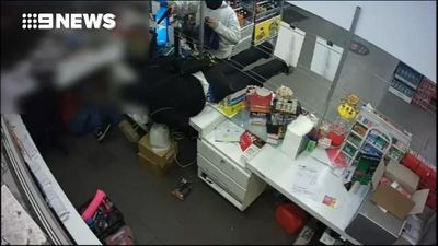 The moment armed thieves storm a Melbourne service station