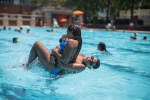 Teenagers cool off at the Hamilton Fish pool, Tuesday, July 18, 2017, in the Lower East Side neighborhood of Manhattan. ...