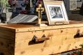 Val Jeffery's grand-daughters Madelaine and Charlotte give a reading at his funeral. Mr Jeffery's coffin was made by ...