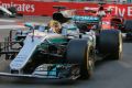 Fuel to the fire: Lewis Hamilton of Mercedes, with Ferrari driver Sebastian Vettel in tow - who appeared to ...