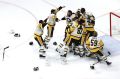 Matt Murray of the Pittsburgh Penguins celebrates with teammates after they defeated the Nashville Predators 2-0 to win ...