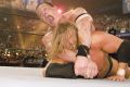 John Cena (top) wrestles Triple H at Wrestlemania 22. 