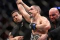 Coming home: The required title fight between newly-crowned interim champion Robert Whittaker and the injured Michael ...