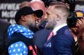 Fighters Floyd Mayweather jnr and Conor McGregor get up close and personal.