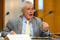 One Nation Senator Malcolm Roberts puts questions to Chief Scientist Dr Alan Finkel during a Senate Estimates hearing at ...