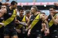 Leaps and bounds: Tigers Toby Nankervis, Trent Cochin, Brandon Ellis and Daniel Rioli after the win over Greater Western ...