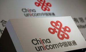 Company logos of China Unicom are displayed at a news conference during the company's announcement of its annual results in Hong Kong, China March 16, 2016. Photo: Reuters/Bobby Yip