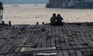 A decrepit jetty at sunset on the shores of Yangon, home to more than 90% of Myanmar's port capacity.
Photo: AFP/Ye Aung Thu