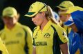 Down and out: Australia captain Meg Lanning (right) and her team come to terms with defeat in the World Cup semi-final.