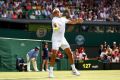 Roger Federer pictured in his all white attire at the All England Club.