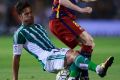 Top class: Western Sydney Wanderers signing Alvaro Cejudo tackles FC Barcelona's Andres Iniesta.