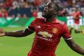 New kid: Manchester United's Romelu Lukaku reacts to scoring a goal against Manchester City during the first half of an ...