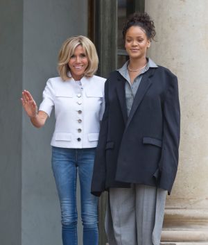 Brigitte Macron, left, the wife of French President Emmanuel Macron and singer Rihanna pose for the media after a meeting.