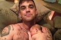Famous dad Robbie Williams shared a photo of tiny Theodora Rose sleeping on his chest. 