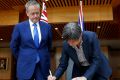 Opposition Leader Bill Shorten and Senator Penny Wong sign the condolence book for the London attack, at Parliament ...