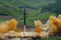 This July 4 photo, distributed by the North Korean government, shows what was said to be the launch of a Hwasong-14 ...