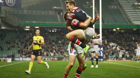 SYDNEY, AUSTRALIA - JULY 29: Luke Keary of the Roosters celebrates scoring a try with team mate Mitchell Pearce during ...