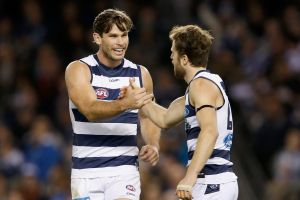 Tom Hawkins and Jordan Murdoch of the Cats celebrate a goal.