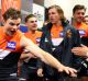Mood change: Heath Shaw of the Giants and team mates celebrate as they greet fans in their changeroom after besting ...