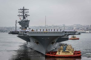 SAN DIEGO (June 5, 2017) Sailors aboard the aircraft carrier USS Nimitz (CVN 68) man the rails and give passing honors to the USS Midway Museum while pulling out of the San Diego Bay for deployment.