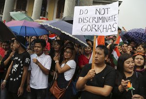 Protestors demanding the creation of separate state of Gorkhaland in India's north-east, shout slogans during a demonstration in Bangalore, India, Tuesday, June 20, 2017.