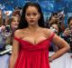 Singer Rihanna poses for photographers on arrival at the premiere of the film 'Valerian', in London, Monday, July 24, ...