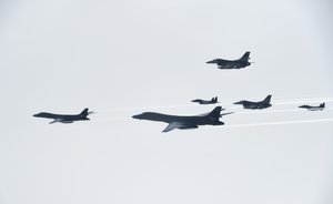 U.S. Air Force B-1B Lancers assigned to the 9th Expeditionary Bomb Squadron, deployed from Dyess Air Force Base, Texas, fly with South Korean F-15 and U.S. Air Force F-16 fighter jets over the Korean Peninsula, July 7, 2017.