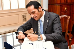 Qatari Foreign Minister Sheikh Mohammed bin Abdulrahman Al Thani signs U.S. Secretary of State Rex Tillerson's guestbook before their bilateral meeting at the U.S. Department of State in Washington, D.C., on July 26, 2017