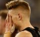 A dejected Adam Treloar after Collingwood's draw with Adelaide.