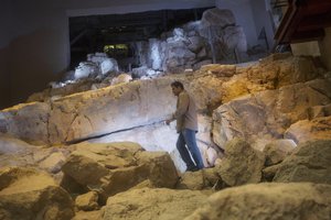 In this Thursday, May 1, 2014, photo, Eli Shukron, an archeologist formerly with Israel's Antiquities Authority, walks in the City of David archaeological site near Jerusalem's Old City. Shukron, who excavated at the site for nearly two decades, says he has found the legendary citadel captured by King David in his conquest of Jerusalem