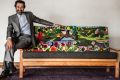 Sayd Shahmamood Abdali and the tapestry couch he helped craft.
