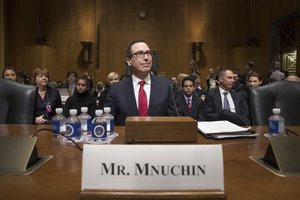 Treasury Secretary-designate Steven Mnuchin arrives on Capitol Hill in Washington, Thursday, Jan. 19, 2017, to testify at his confirmation hearing before the Senate Finance Committee.