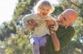 Jarek Luszpinski plays with his two year old daughter Pola.