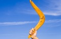 A boomerang in front of a blue sky