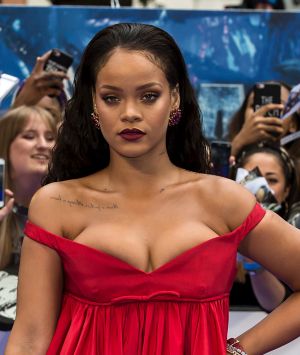 Rihanna, seen "bursting" out of her dress at the premiere of her new movie. 