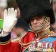 Queen Elizabeth II and the Duke of Edinburgh in a carriage as the royal procession makes its way down The Mall from ...