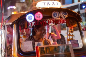 See, smell and taste Bangkok from the back of a tuk-tuk.