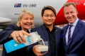 Qantas representative Alison Webster (left), Sean Shwe, managing director of Moon Lake Investments (centre), and ...