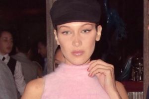 Bella Hadid wearing a black?beret and pink midriff top. August 2, 2017. Photo:?Instagram