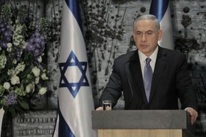 Israeli Prime Minister Benjamin Netanyahu speaks during a ceremony with Israeli President Reuven Rivlin, not seen, in Jerusalem, Wednesday, March 25, 2015. Netanyahu struck a conciliatory tone on Wednesday as he was formally tapped to form a new government, vowing to heal rifts in Israeli society and fix ties with the United States following an acrimonious election campaign.