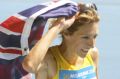 Australia's Kerryn McCann celebrates her marathon victory with son Benton.