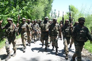 Indian army soldiers shout pro India slogans as they return from the scene of a gun fight at Dialgam in Anantnag some 60 kilometers south of Srinagar, the summer capital of Indian Kashmir, 01 July 2017. A top commander of the militant outfit Laskhar-e-Toiba (LeT) Bashir Lashkari and his associate were killed during the gunfight with security forces in Anantnag. Two civilians were also killed and several others injured as government forces allegedly opened fire at protesters during clashes near the scene of the clash.