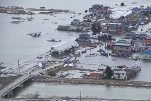 An aerial view of Minato, Japan, a week after a 9.0 magnitude earthquake and subsequent tsunami devastated the area.