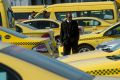 MELBOURNE, AUSTRALIA - AUGUST 24:  Taxi drivers are seen biding their time  as they wait their turn at the Taxi Holding ...