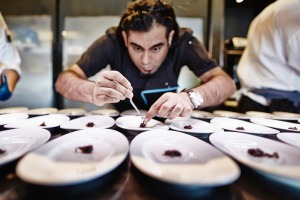 Chef Gaggan Anand plates for service.