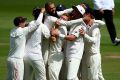 England celebrate with Moeen Ali after he takes the final wicket of Morne Morkel.