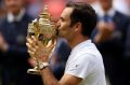 A familiar sight: Federer kisses the trophy after beating Marin Cilic.