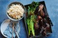 Twice-cook duck with charred Asian greens.