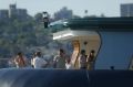 Old friends: James Packer in 2005 aboard Arctic P with Tom Cruise and Katie Holmes (right) and Tommy Davis (shirtless, ...